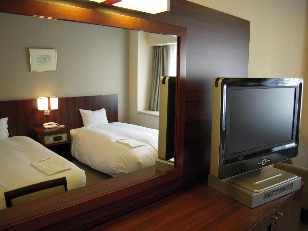 Hotel Sunroute New Sapporo Rum bild